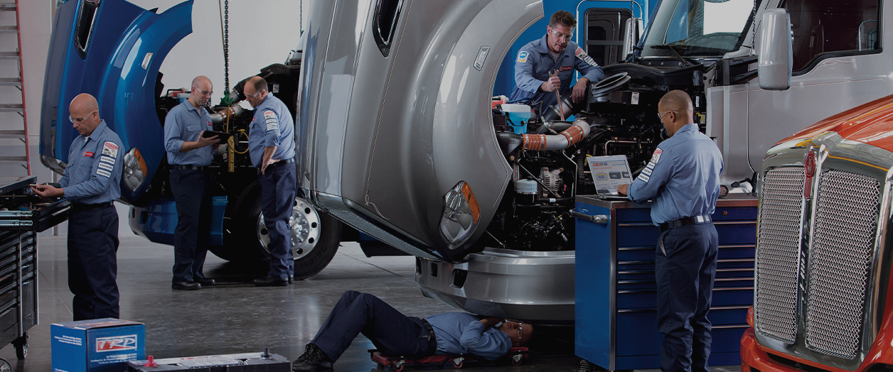 Kenworth mechanics in truck stop garage